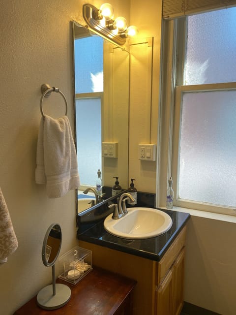 Combined shower/tub, hair dryer, towels, soap