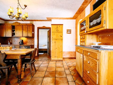 Furniture, Cabinetry, Property, Table, Wood, Interior Design, Lighting, Kitchen, Countertop, Door