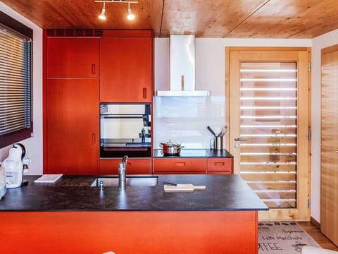 Property, Cabinetry, Furniture, Building, Countertop, Kitchen, Interior Design, Orange, Wood, Window
