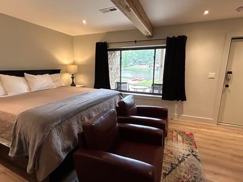 View from downstairs bedroom and door out to patio with bistro set