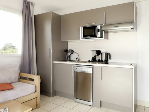 Room, Furniture, Property, Kitchen, Cabinetry, Interior Design, Building, Major Appliance, House, Kitchen Stove