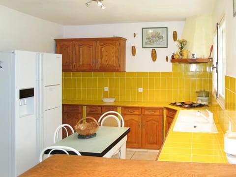 Room, Furniture, Property, Kitchen, Floor, Cabinetry, Building, Interior Design, Yellow, House