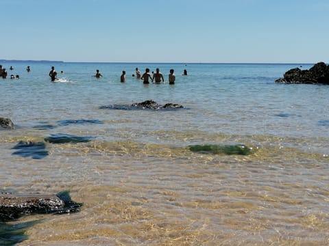 On the beach, sun loungers