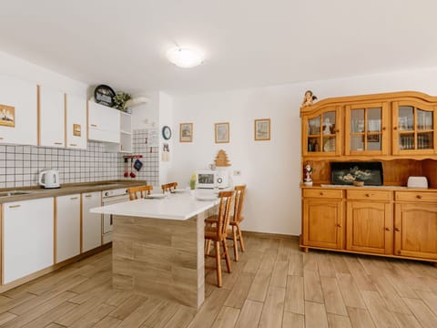 Flooring, Furniture, Floor, Interior Design, Wood, Cabinetry, Kitchen, Wood Flooring, Countertop, Cupboard