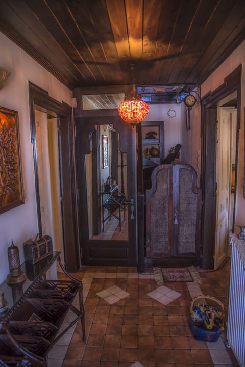 Εntrance hall
Τhe wooden small door separates the lower floor from the attic