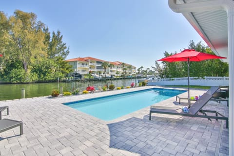 A heated pool, sun loungers