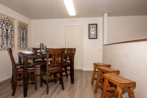 Table seats 8.  Additional Folding table in Bunk Bedroom for dining or games