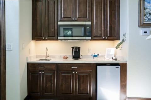 Our kitchenette has a sink , microwave, coffee maker and mini fridge