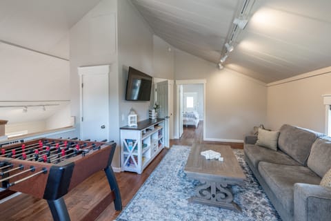 Upstairs loft with 55" smart TV, foosball table, checker/chess table and games.