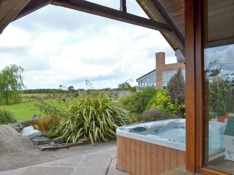 Patio area with hot tub | Carr End Barn A, Stalmine, near Poulton-le-Flyde