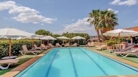 A heated pool, sun loungers