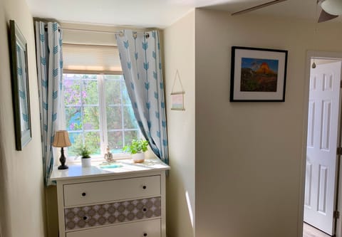 Master bedroom overlooks backyard, beautiful afternoon light, blackout drapes