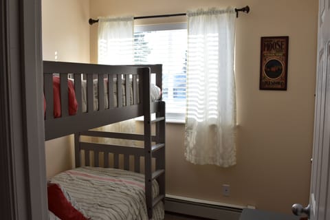 The small third bedroom has a brand new bunk bed. A third trundle bed is below.