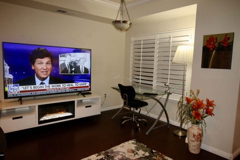 Wow! 75 inc TV on stand with Fireplace.Notice the desk.Perfect working from Home