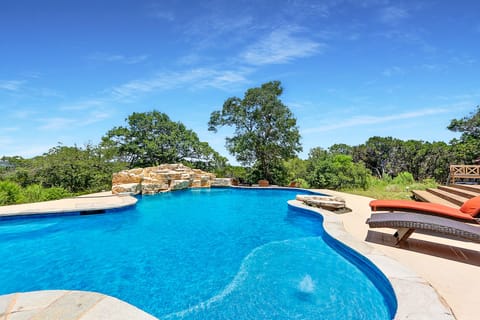 Sparkling blue pool with gorgeous Hill Country views