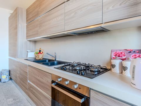 Kitchen, Kitchen Appliance, Countertop, Major Appliance, Wood, Cabinetry, Flooring, Interior Design, Home Appliance, Kitchen Stove