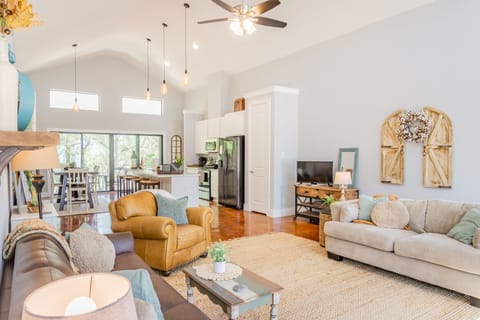 Living room is an open space next to the kitchen and dining