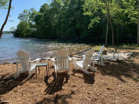 Relax in the adirondack chairs while the kids play in the sand 
