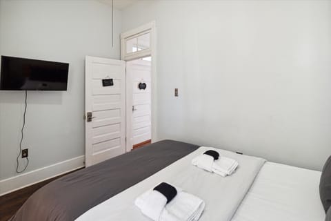 Peace room is a private bedroom with queen bed and Roku Smart TV.