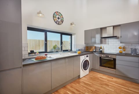 Ground floor: Well equipped kitchen with high gloss units and a dishwasher