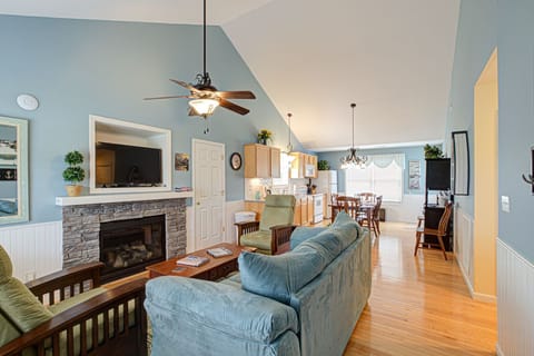 View when opening the front door. Open floor plan with living room & kitchen.