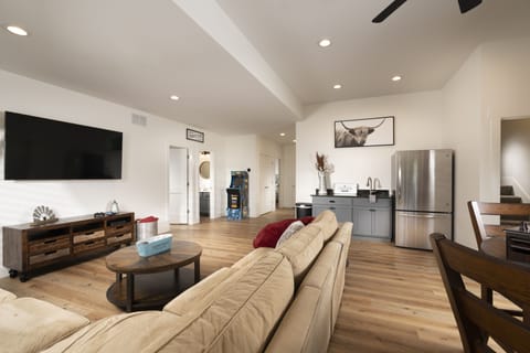 Huge lower level living area with 70" Smart TV, game table, arcade game