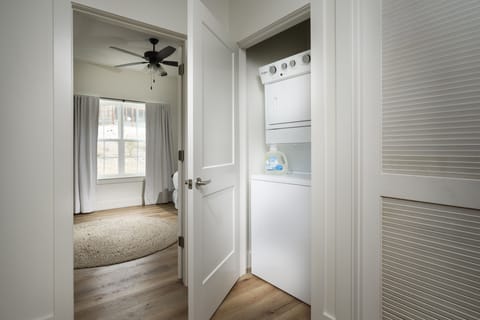Stacked washer and dryer units on the top level.