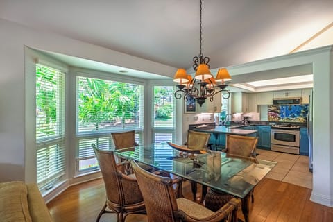 The open concept kitchen, dining, and living area make for an easy flow of conversation and activity, while the breakfast bar seating gives you options for quick bites!