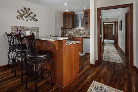 The wet-bar just off the kitchen is another perfect gathering spot for your group to enjoy.
