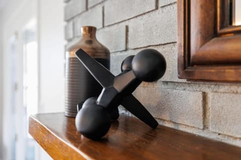 Family room overlooking backyard near kitchen and door leading to back porch. Details of room