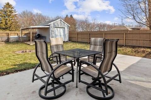 Back patio with seating for 4 and fire pit. Fenced in backyard