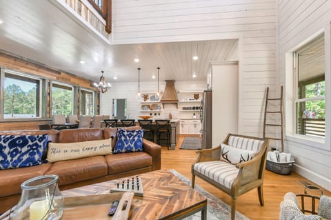 The living room seamlessly transitions into the kitchen/dining area.