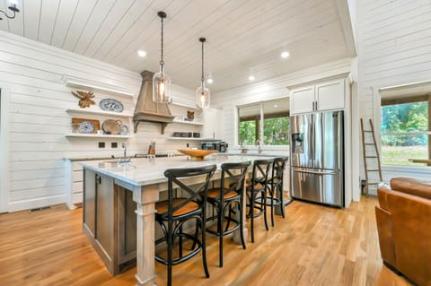 The kitchen provides extra seating at the island. 