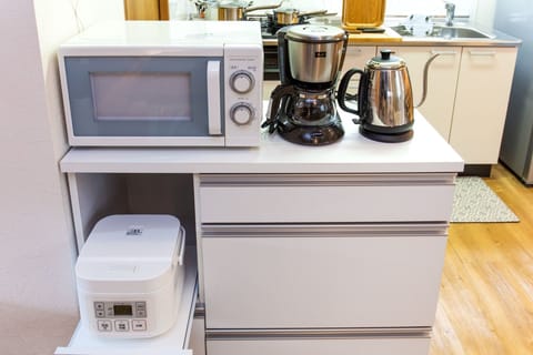 Fridge, microwave, stovetop, cookware/dishes/utensils