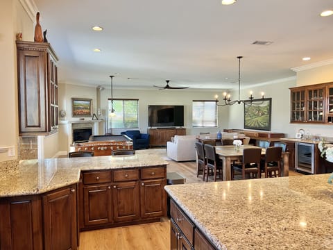 Great room with Foosball Table, Shuffle Board, Pool Table, and 86" Smart TV.