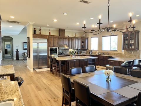 Fully Stocked Kitchen with Island large enough to accommodate many cooks:-)