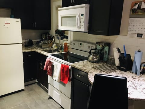 Full kitchen with new countertops, heated floors