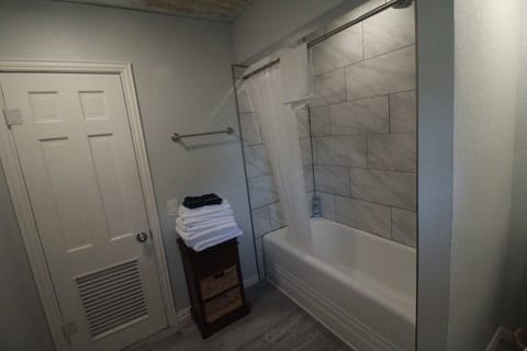 Combined shower/tub, hair dryer, towels, soap