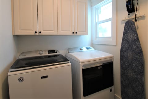 Bright space with modern machines for effortless vacation laundry days!