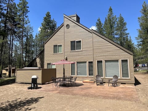 Large private patio area with Weber gas grill and outdoor table.