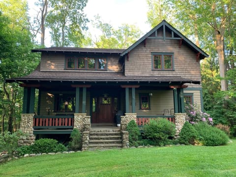 Lovely Arts and Crafts style home in a wooded setting. 