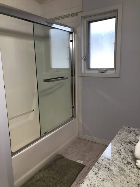 Combined shower/tub, jetted tub, hair dryer