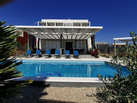 Outdoor pool, a heated pool, pool umbrellas, sun loungers