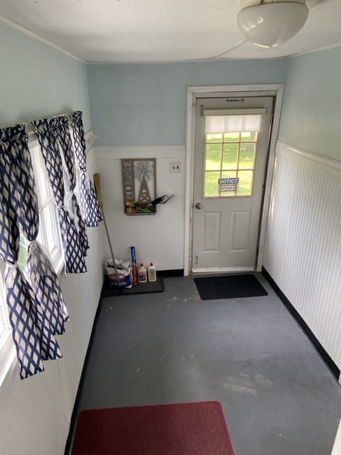 Mudd room leading to the backyard.