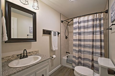 Combined shower/tub, hair dryer, towels, soap