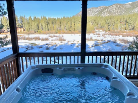 - Relax in the hot tub with mountain views
- Scenic forest and snowy meadow backdrop
- Lake Tahoe cabin rental with spa retreat