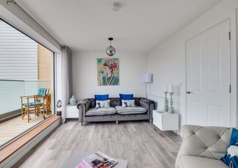 Lounge with Bi-fold doors to Balcony overlooking the Links and Sea