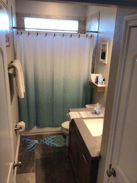 Combined shower/tub, hair dryer, towels, soap