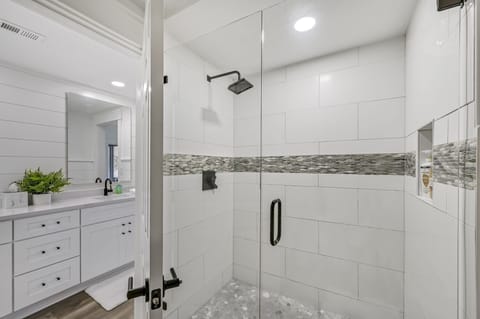 Combined shower/tub, hair dryer, towels, soap