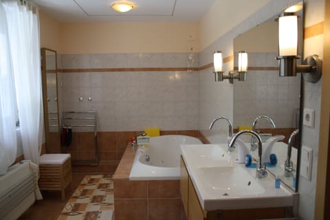 Combined shower/tub, hair dryer, towels, soap